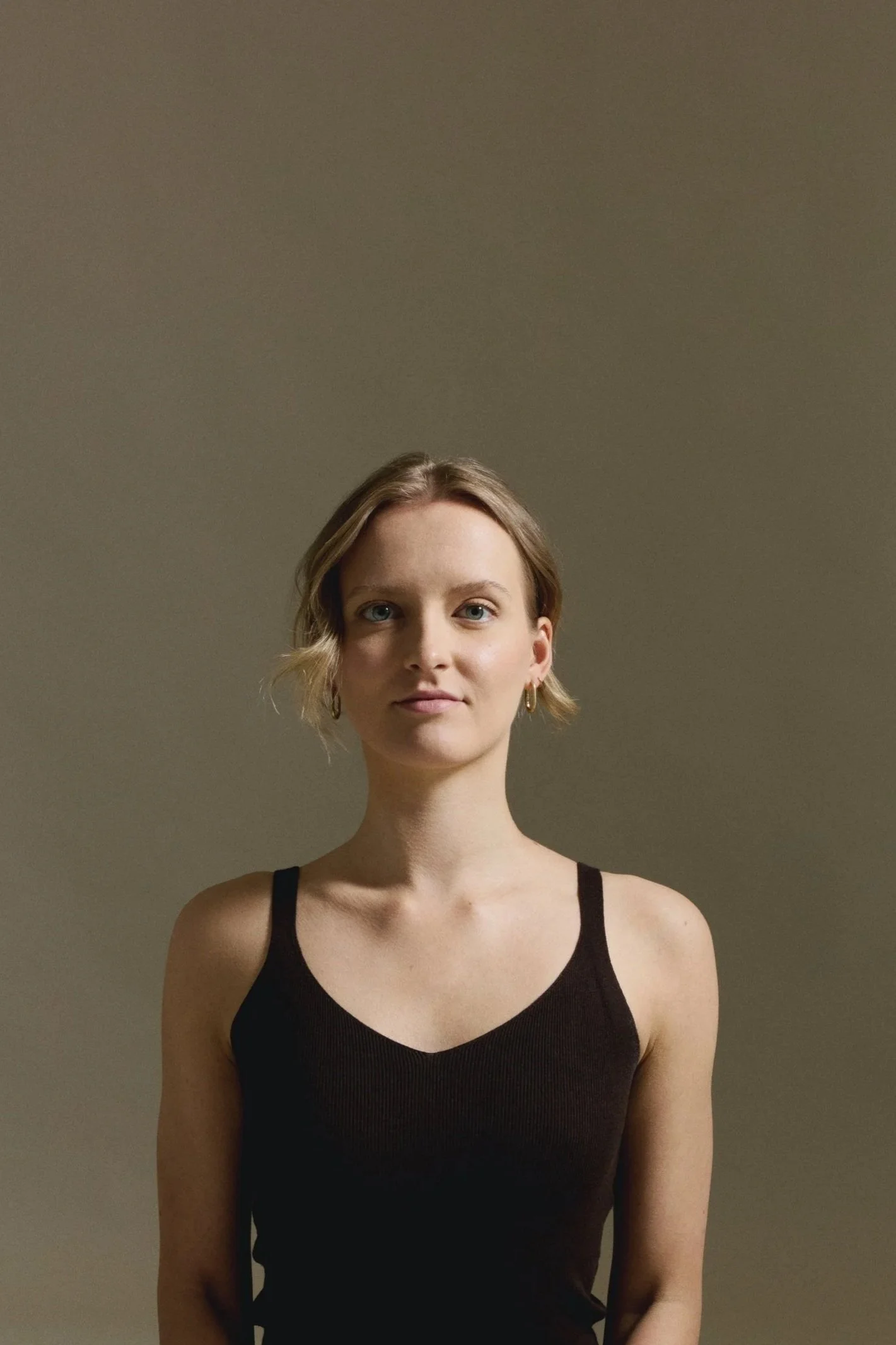 Matthäa standing in a quiet Berlin studio