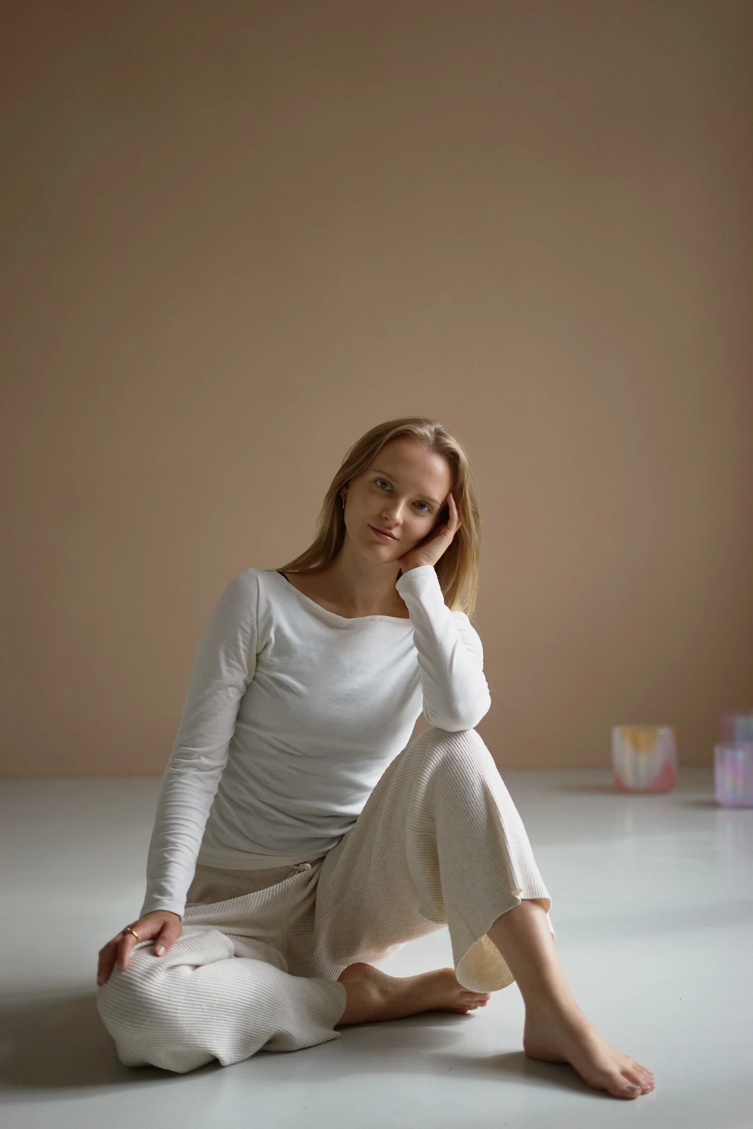Matthäa seated in meditation beside a studio wall