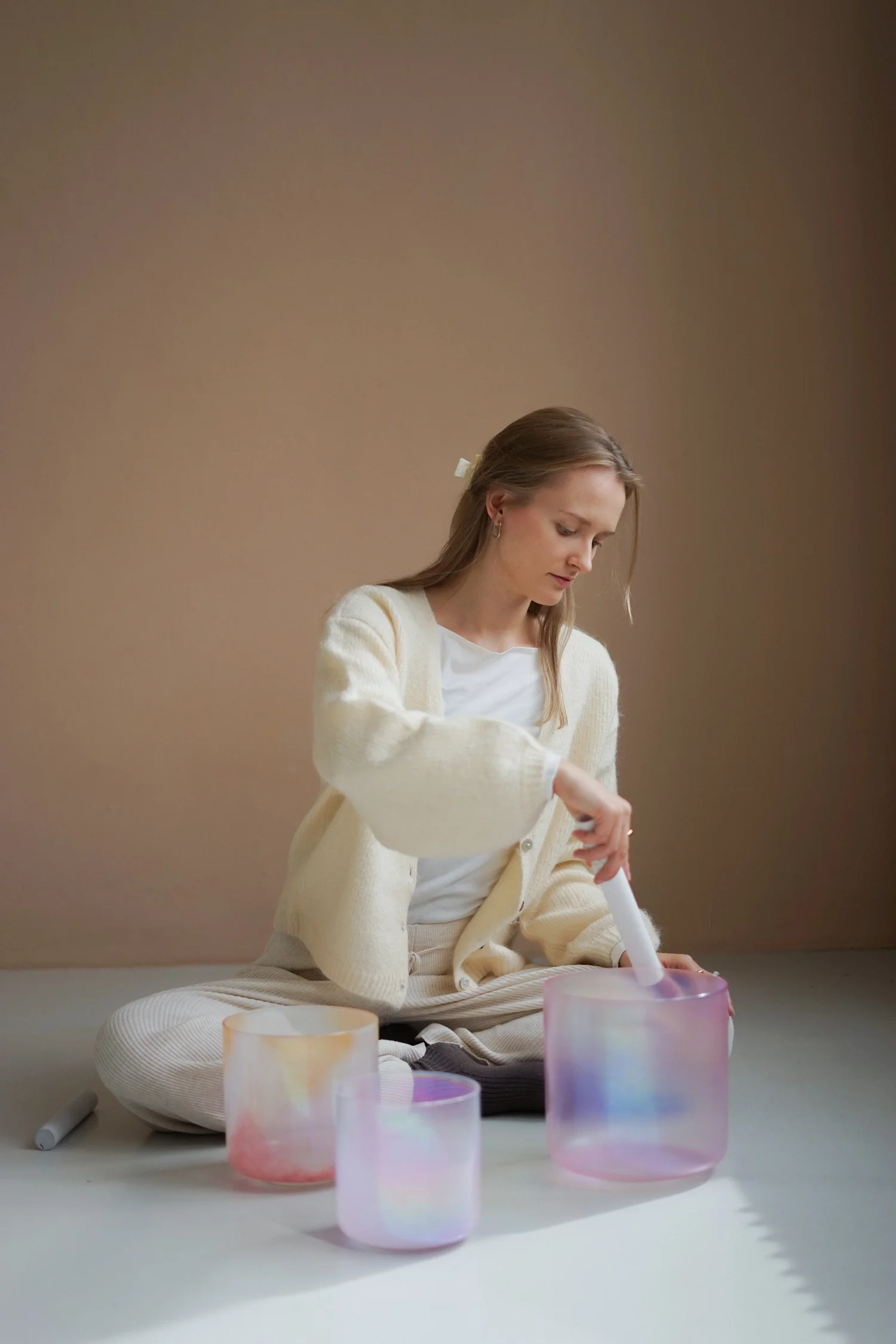 Crystal singing bowls arranged on a studio floor